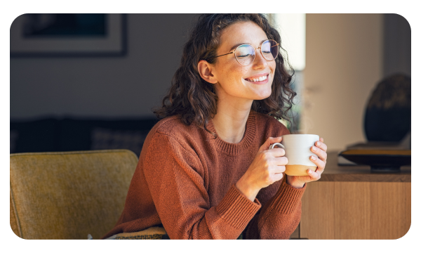 Mom drinking tea alone and smiling