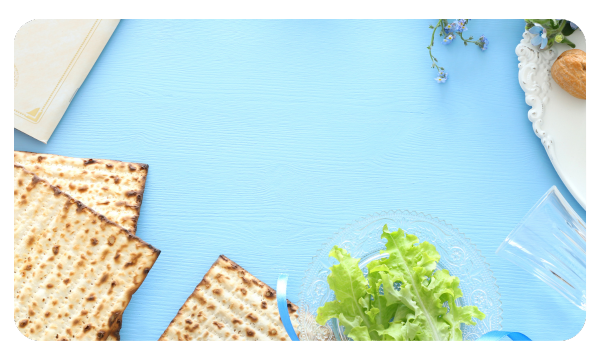 Blue backdrop with matzah and seder plate framing