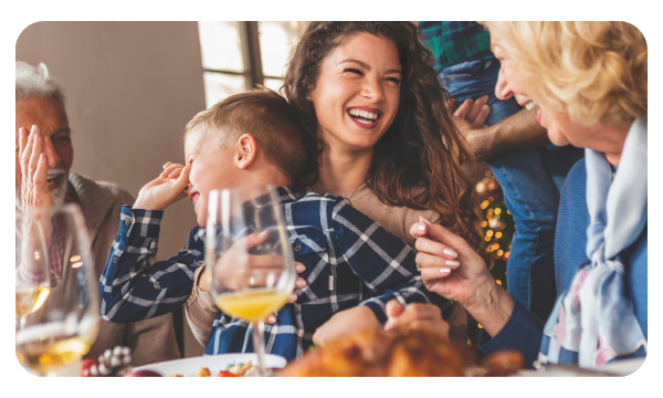 Mother and child smiling at the dinner table
