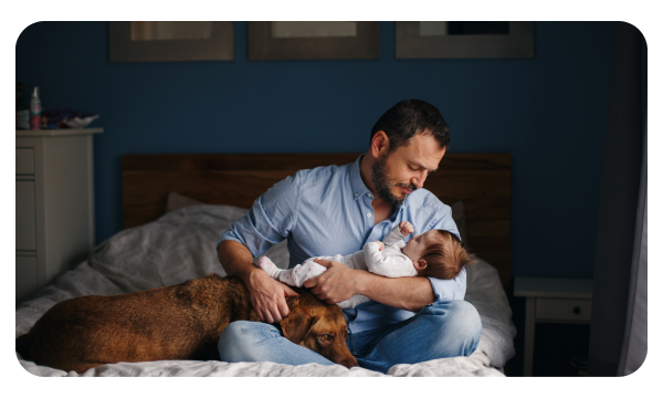 New father holds a sleeping baby