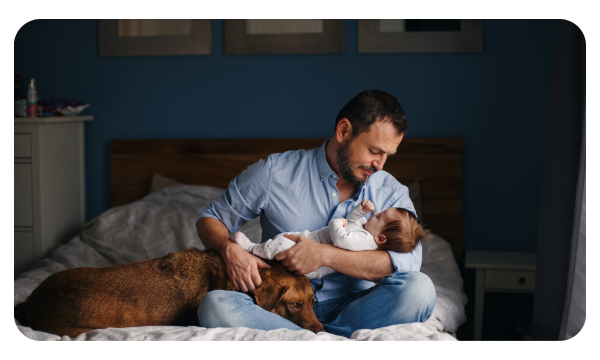 New father holds a sleeping baby